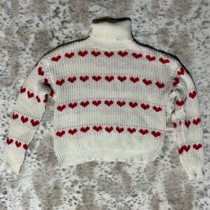 Chic White Turtleneck Sweater with Red Heart Accents